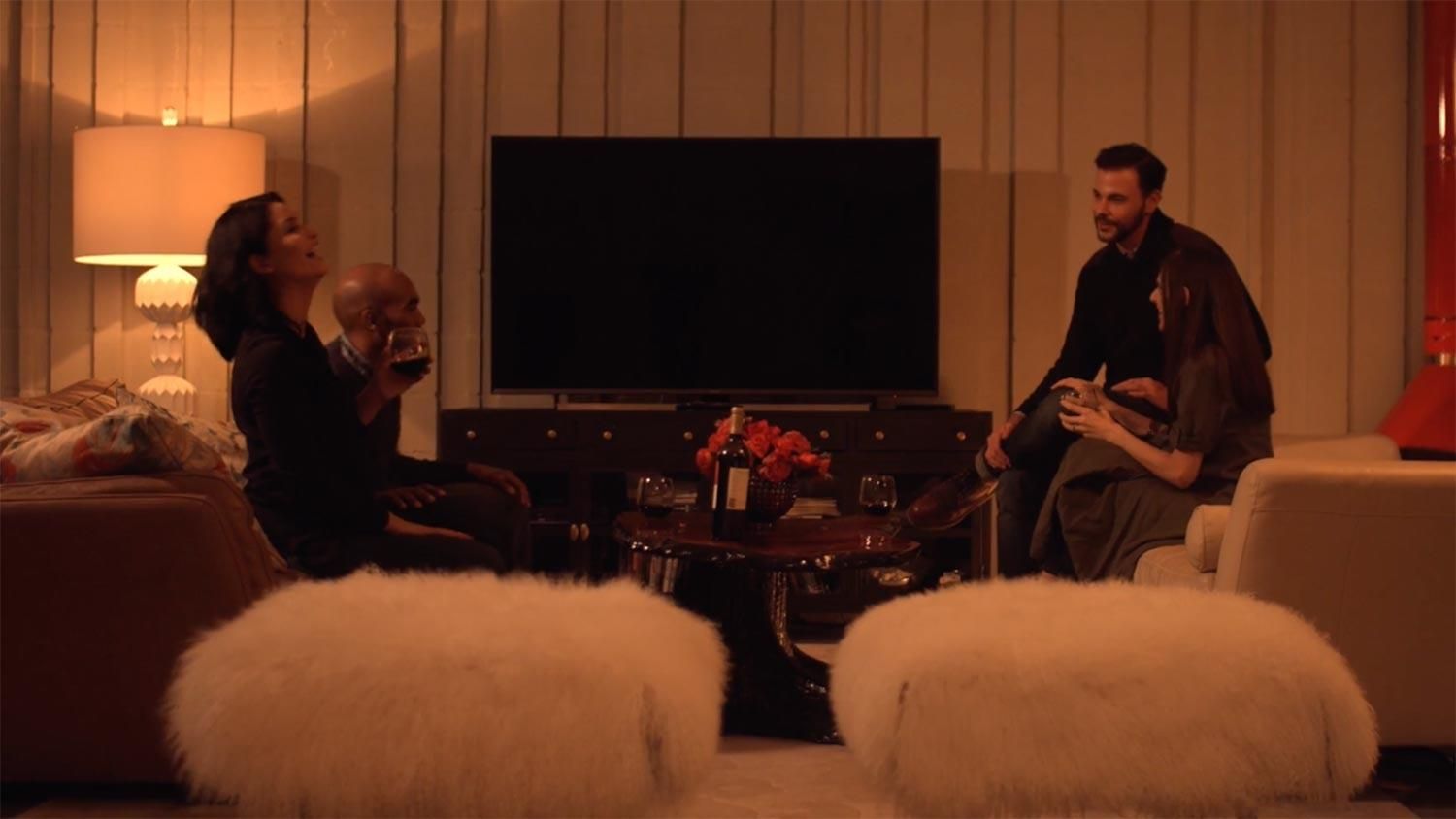 People in a dimly lit living room